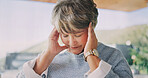 Senior, woman and headache with stress in home for mental health, fatigue or alzheimers. Elderly, tired or female person with migraine or pressure for memory loss or strain in retirement house