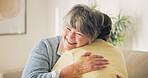 Love, happy woman and hug with senior mother in home for care, support and bonding together. Adult daughter, smile and embrace parent on couch with connection, affection and security with family