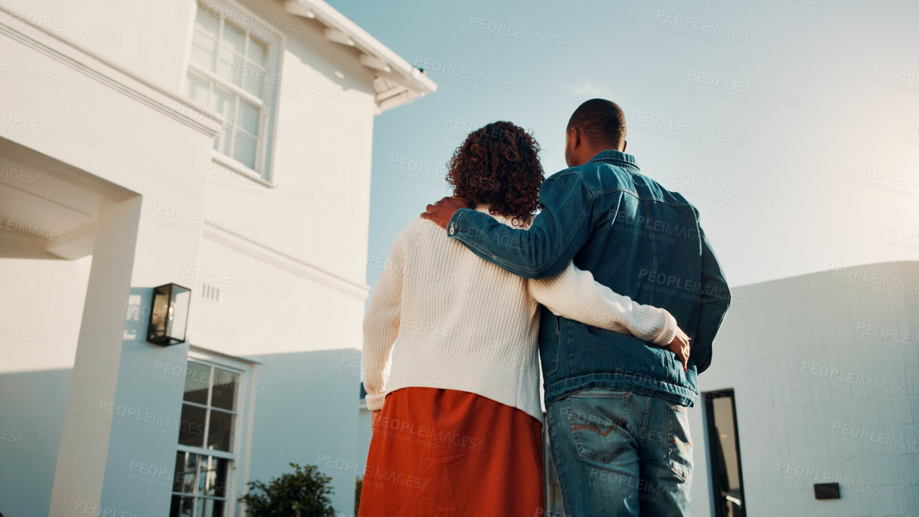 Buy stock photo Back, hug and couple in front yard with new house, relocation and support for property investment. Low angle, married people and embrace outdoor with dream home, mortgage loan or bond for real estate