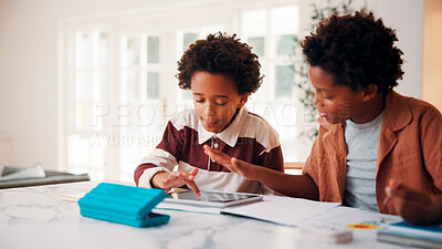 Buy stock photo Children, education and helping in home with tablet for homework, research or teaching. App, learning and school assignment with sibling boys at counter in kitchen together for development or support