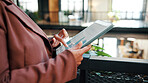 Woman, hands and tablet in office with data analysis, check KPI or graphs for worker productivity rate. Person, scroll and tech in business for statistics, employee performance or efficiency metrics.