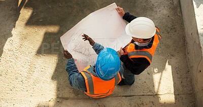 Buy stock photo Team, above or engineer at construction site with blueprint, development review or schematic discussion. Top view, people or document for architecture design, building planning or strategy evaluation
