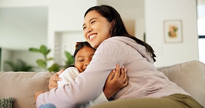 Buy stock photo Hug, love and mom with child on sofa for bonding, healthy relationship and security for parenting. Family, happy and mother with girl in embrace for affection, connection or support for trust in home