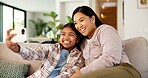 Selfie, happy and mom with child on sofa for social media, picture and memory for bonding on weekend. Family, phone and mother with girl for post, photo and smile for moment, love and care in home