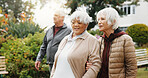 Outdoor, walk and old people by retirement home with conversation, fitness and support for exercise. Active, senior women or friends in garden with discussion, wellness or gossip for bonding together