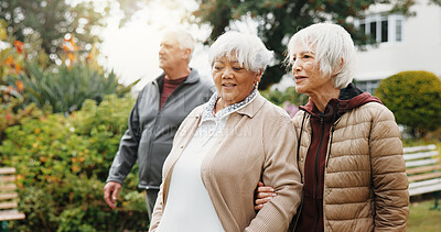 Buy stock photo Outdoor, walk and old people by retirement home with conversation, fitness and support for exercise. Active, senior women or friends in garden with discussion, wellness or gossip for bonding together