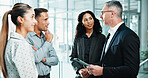Conversation, tablet and teamwork with business people in office lobby for project management. Collaboration, discussion and employee group with meeting, report and planning together in workplace