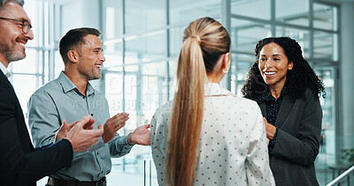 Buy stock photo Business people, woman and applause in office for promotion, positive reinforcement and support. Employee, winner and happy in lobby for career growth, successful campaign or achievement with smile