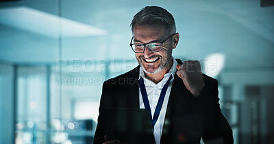 Buy stock photo Happy, businessman and winning with tablet in night office for online investment, promotion or bonus. Excited, mature man or employee working late with smile or fist pump on tech for business success
