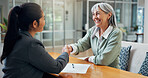 Smile, old woman and handshake at house with advisor, real estate deal and purchase agreement. Senior person, shaking hands and thank you for consultation, retirement benefits and finance negotiation