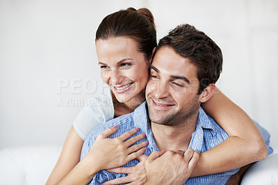 Buy stock photo Love, relax and happy with couple on sofa in home for bonding, support and weekend break. Smile, connection and commitment with man and woman in living room of house for marriage, care and loyalty