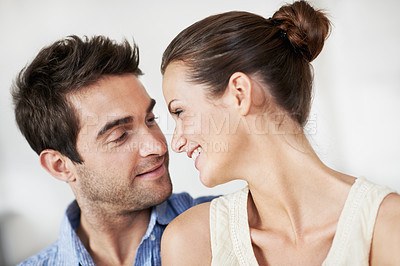 Buy stock photo Relax, couple and smile with love in home for bonding together, healthy marriage and conversation. Care, support and happy people with talk in house for connection, commitment and relationship trust