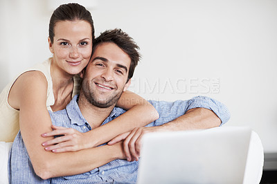 Buy stock photo Portrait, laptop and hug with couple on sofa in home for travel planning, bonding and relationship. Embrace, holiday budget or honeymoon research with people in house for connection, support or space