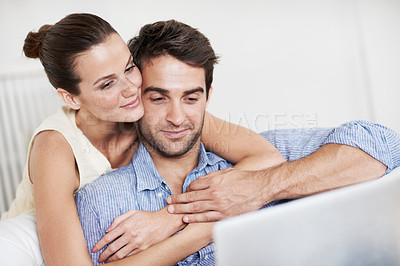 Buy stock photo Relax, laptop and smile with couple on sofa in home for travel planning, hug and flight booking. Connection, holiday budget and honeymoon research with man and woman in living room for bonding