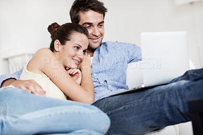 Buy stock photo Laptop, calm and smile with couple on sofa for streaming service, bonding and movie subscription. Online film, love and multimedia search with man and woman in living room of home for connection