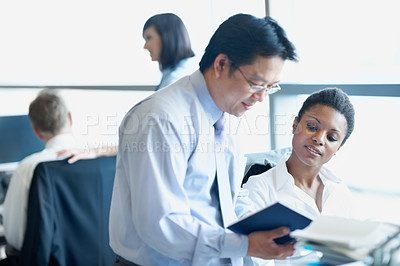 Buy stock photo Coaching, notebook and feedback with business people in office for account update, research and team. Bookkeeping, training and performance review with employees for discussion on budget report