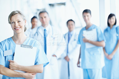 Buy stock photo Team, portrait and smile with nurse in hospital for healthcare, solidarity and consulting. Medical, community and about us with people in lobby of clinic for support, doctors and collaboration
