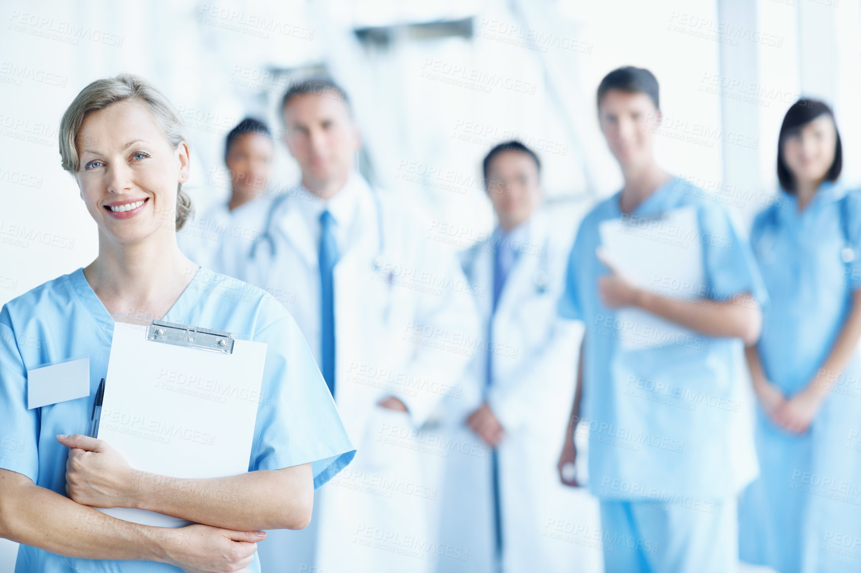 Buy stock photo Team, portrait and smile with nurse in hospital for healthcare, solidarity and consulting. Medical, community and about us with people in lobby of clinic for support, doctors and collaboration