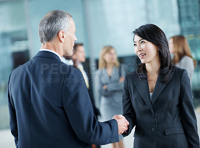 Buy stock photo Business, people and hello handshake in lobby for networking, greeting and seminar break. Global conference, employees and shaking hands at event for introduction, partnership opportunity and happy