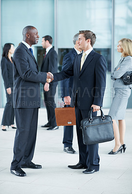 Buy stock photo Business, men and handshake greeting in lobby for networking, introduction and seminar break. Global conference, people or shaking hands at event for headhunting, professional connection or workshop