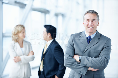Buy stock photo Portrait, arms crossed and conference with business man as keynote speaker, broker expo or smile. Happy, coworkers and about us with mature employee at convention center for investor seminar