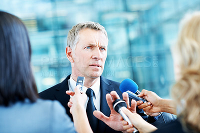 Buy stock photo Interview, worry and microphone with business man in office for insider trading, journalist and speaker. Market manipulation, press release and news broadcast with people  for information leak