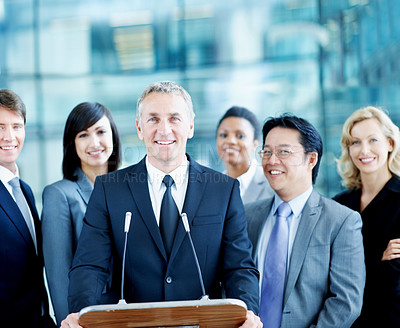 Buy stock photo Speaker, podium and portrait with business people at conference for keynote guest, talk and lecture. Capital venture, investor expo and crowd with person at seminar for pitch and account advisor