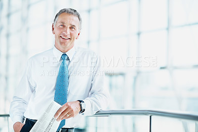 Buy stock photo Business, happy man and portrait with newspaper in office, professional and real estate auction news. Property development, mature person and daily paper with listing opportunity, space and lobby