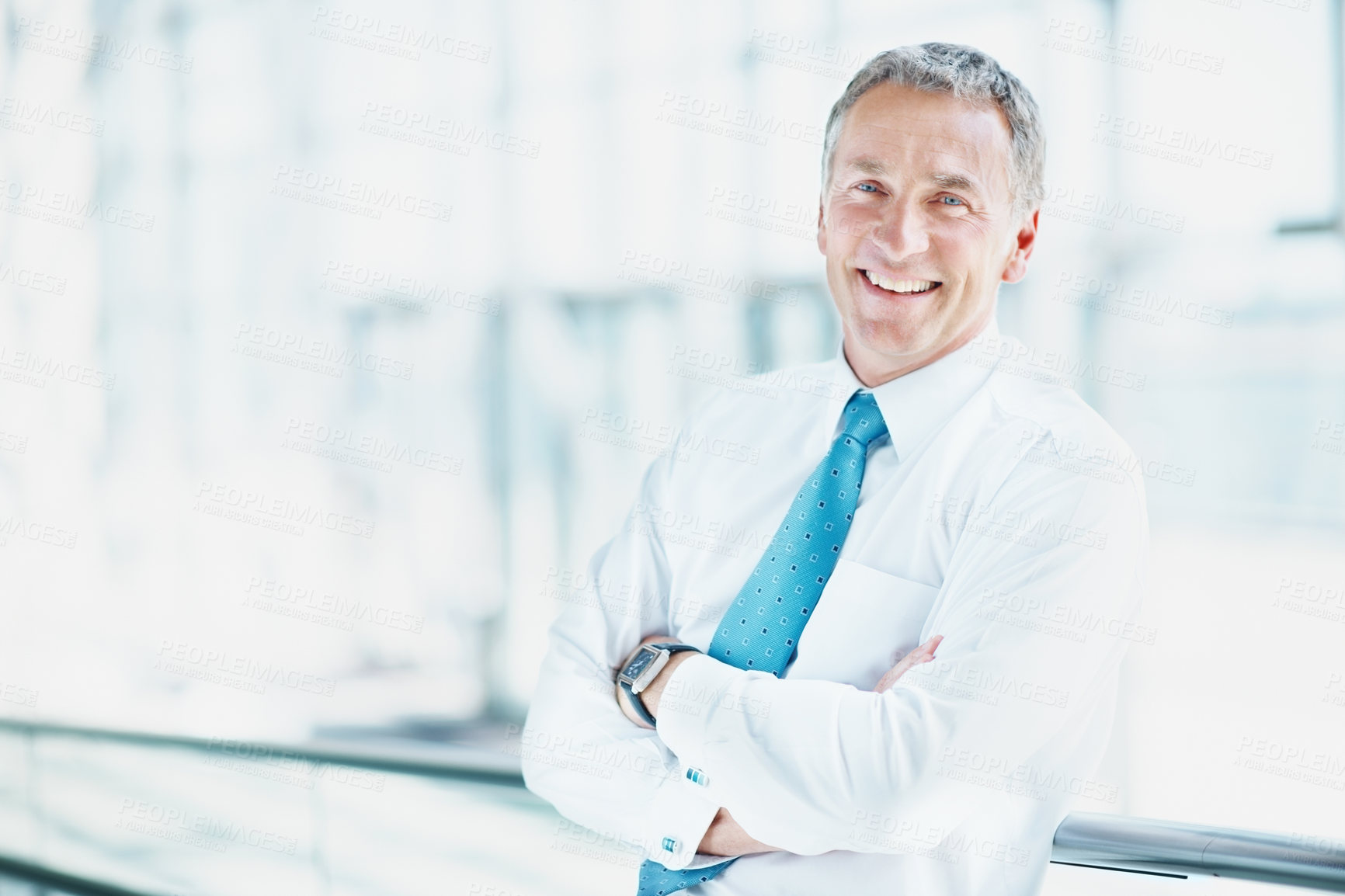 Buy stock photo Business man, smile and arms crossed in office, professional portrait or about us for real estate. Property development, ambition or opportunity in work space or mature person in building lobby