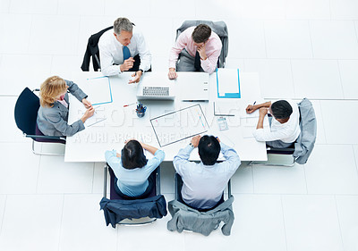 Buy stock photo Above, business and people in meeting in office, finance team and budget overview talk. Group, collaboration and paperwork with pc for financial planning, revenue and expenses chat at workplace