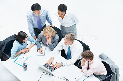 Buy stock photo Above, people and typing on laptop in conference room, finance team and budget overview discussion. Group, collaboration or paperwork with pc for financial plan, revenue or expenses agenda in meeting
