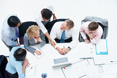 Buy stock photo Top view, business people and meeting in conference room, finance and team for budget overview. Group, collaboration and paperwork with pc for financial planning, revenue and expenses chat in office