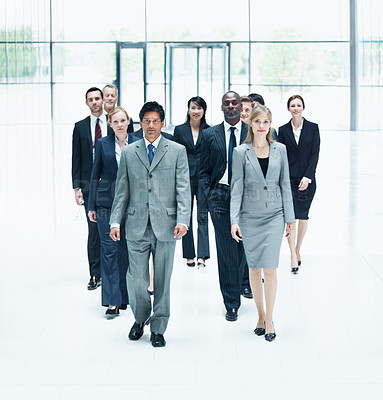 Buy stock photo Portrait, team and walking with business people in huddle for community, solidarity or diversity. Synergy, support and partnership with group of employees in lobby for career, about us and mission