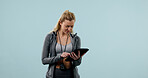 Tablet, woman or personal trainer in studio with fitness, mockup space or confused for wellness trend. Workout coach, person and scroll with tech, website or doubt for exercise fad on blue background