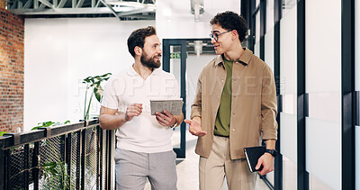Buy stock photo Business, tablet and walking with men in design office for feedback, planning or strategy. App, conversation and review with designer people in creative workplace for advice, report or research