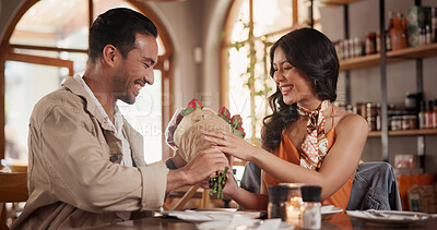 Buy stock photo Love, happy or couple in restaurant with flowers, relationship gift or bonding in anniversary celebration. Commitment, present or people with bouquet, special moment or connection with romantic date.