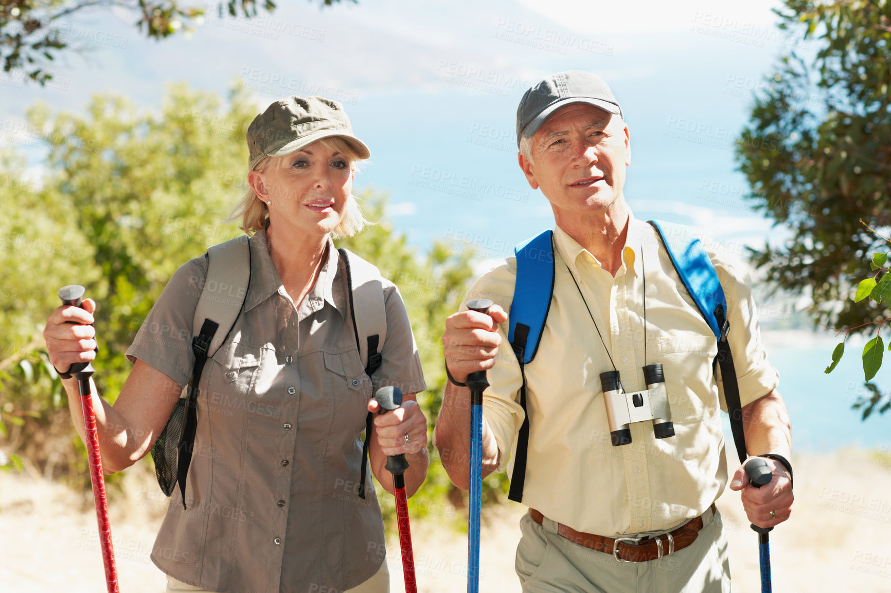 Buy stock photo Pole, hiking and explore with old couple in nature for bonding, adventure or nordic walking. Anniversary date, trekking stick or fitness with senior man and woman outdoor for tourism and travel