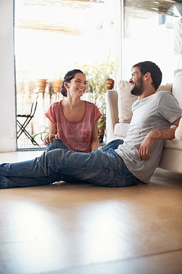 Buy stock photo Shot of a romantic young couple spending quality time together in their living room