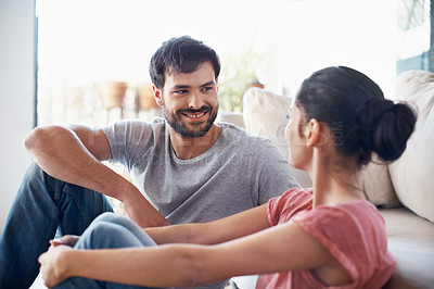 Buy stock photo Shot of a romantic young couple spending quality time together in their living room