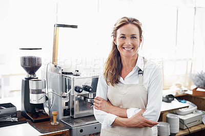 Buy stock photo Portrait of a smiling barista standing in front of a coffee machine