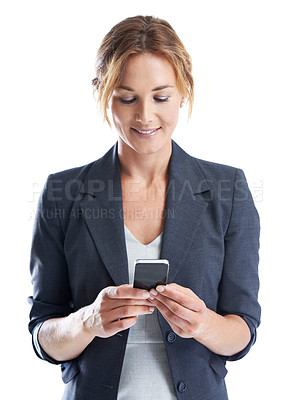 Buy stock photo A cropped shot of a smiling businesswoman texting on her cellphone while isolated on white