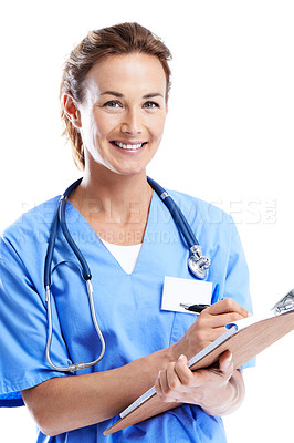 Buy stock photo An attractive female doctor writing on a clipboard while isolated on white