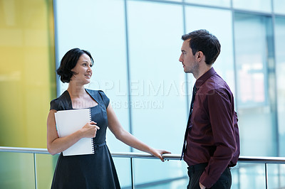 Buy stock photo Shot of two businesspeople having a conversation in an office setting