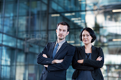 Buy stock photo Portrait of two confident young businesspeople in a professional setting