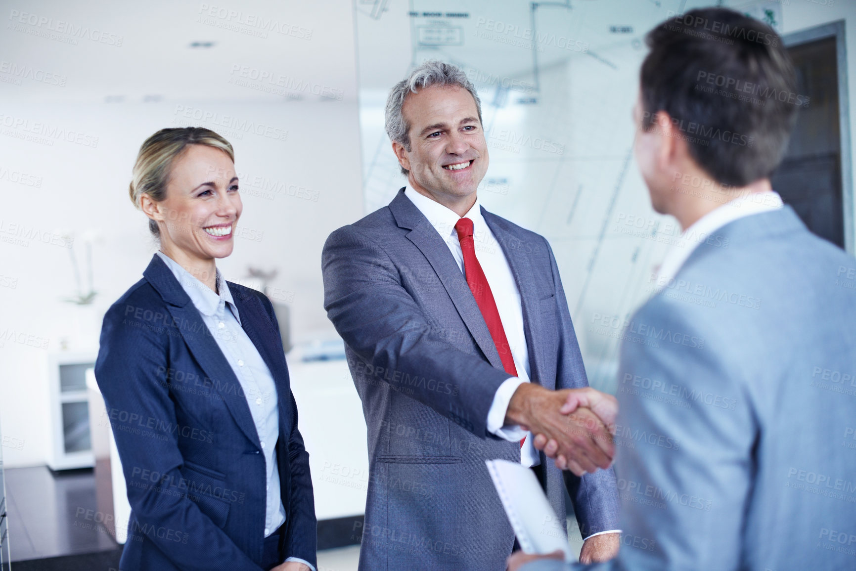 Buy stock photo Smile, handshake and welcome with business people in office for contract, deal and thank you. Partnership, shaking hands and meeting with employees in agency for teamwork, support and opportunity