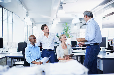 Buy stock photo Shot of a diverse group of businesspeople having a brainstorming session in an office