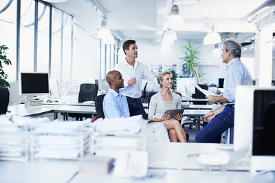 Buy stock photo Shot of a diverse group of businesspeople having a brainstorming session in an office