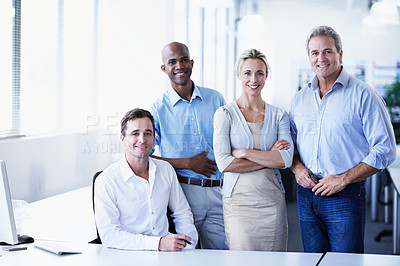 Buy stock photo Portrait of a diverse group of smiling coworkers standing in an office