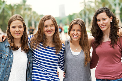 Buy stock photo Group of teen friends standing together and smiling while outdoors
