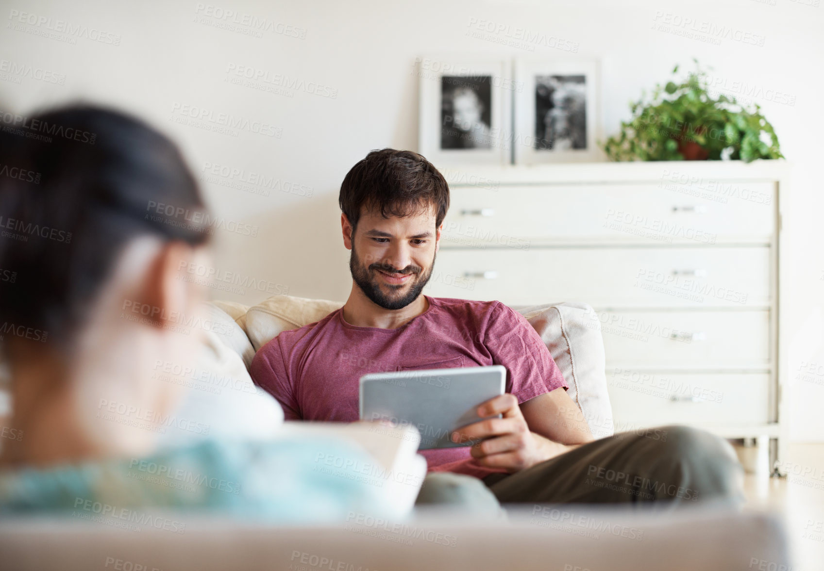 Buy stock photo Book, tablet and reading with couple on sofa in home bonding, streaming and relax with ebook. Virtual library, support and connection with woman and man in living room in house for peace and smile